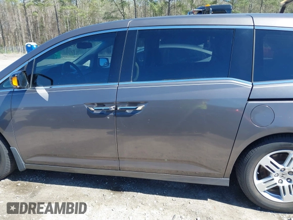 2012 Honda Odyssey Touring with VIN 5FNRL5H91CB057344, listed as a IAAI auction lot 41835272 with 158,854 mi miles. Bid and sale history available at carsss.com. Image 14.