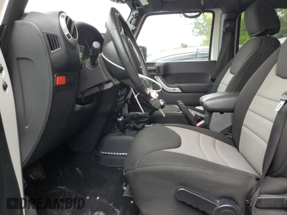 2015 Jeep Wrangler Unlimited Rubicon with VIN 1C4BJWFGXFL518301, listed as a Copart auction lot 61910775 with 153,945 mi miles and Clean title. Bid and sale history available at DreamBid. Image 7.