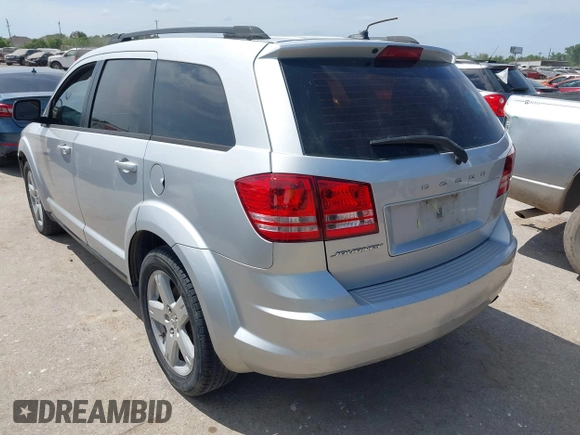 2014 Dodge Journey SE with VIN 3C4PDCAB0ET284437, listed as a IAAI auction lot 42063601 with 206,913 mi miles and . Bid and sale history available at carsss.com. Image 3.