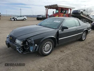 1999 Cadillac Eldorado Touring with VIN 1G6ET1298XU602343, listed as a Copart auction lot 44327195 with 52,327 mi miles and Salvage Title. Bid and sale history available at DreamBid. Image 1.
