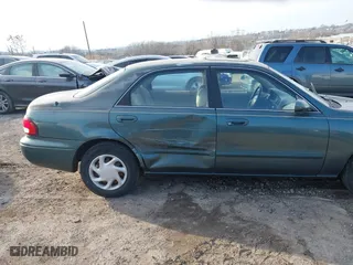 1999 Mazda 626 ES with VIN 1YVGF22C0X5835930, listed as a IAAI auction lot 41666820 with 93,973 mi miles. Bid and sale history available at carsss.com. Image 6.