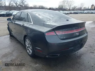 2015 Lincoln MKZ z VIN 3LN6L2JK4FR623686, wystawiony jako IAAI lot #41721095 z przebiegiem 197 922 mil mil oraz . Historia ofert i sprzedaży dostępna na DreamBid. Obrazek 3.