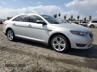 2015 Ford Taurus SEL with VIN 1FAHP2E88FG121647, listed as a Copart auction lot 51660585 with 155,686 mi miles and Clean Title. Bid and sale history available at DreamBid. Image 4.