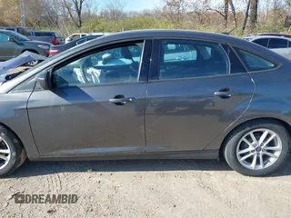 2018 Ford Focus SE z VIN 1FADP3F2XJL316101, wystawiony jako IAAI lot #40805650 z przebiegiem 53 551 mil mil oraz . Historia ofert i sprzedaży dostępna na DreamBid. Obrazek 13.