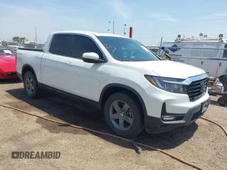2023 Honda Ridgeline RTL with VIN 5FPYK3F51PB028295, listed as a IAAI auction lot 42031783 with 39,228 mi miles and . Bid and sale history available at DreamBid. Image 1.