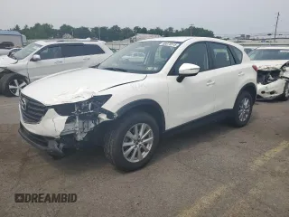 2016 Mazda CX-5 Sport z VIN JM3KE4BY0G0690953, wystawiony jako Copart lot #60875515 z przebiegiem 99 072 mil mil oraz Szkoda całkowita • Salvage title. Historia ofert i sprzedaży dostępna na DreamBid. Obrazek 1.