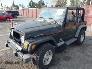 2003 Jeep Wrangler Sport with VIN 1J4FA49S23P328867, listed as a IAAI auction lot 41354414 with 96,703 mi miles. Bid and sale history available at carsss.com. Image 17.