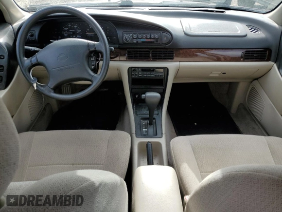 1997 Nissan Altima XE z VIN 1N4BU31DXVC181006, wystawiony jako Copart lot #57670815 z przebiegiem 98 202 mil mil oraz Szkoda całkowita • Salvage title. Historia ofert i sprzedaży dostępna na DreamBid. Obrazek 8.