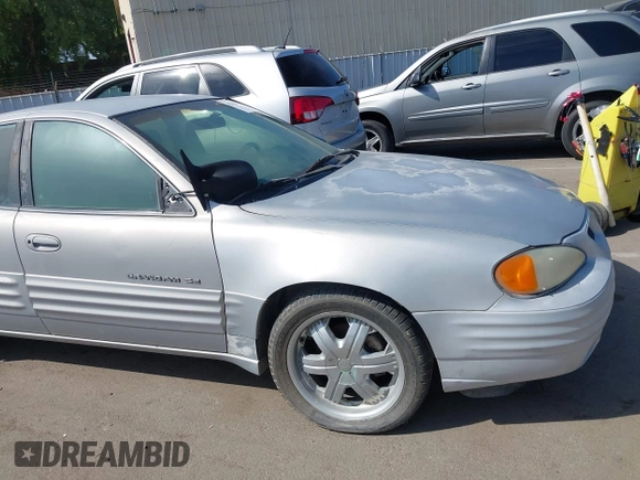 1999 Pontiac Grand Am SE with VIN 1G2NE52TXXC553246, listed as a IAAI auction lot 42398103 with Not provided miles and . Bid and sale history available at DreamBid. Image 6.