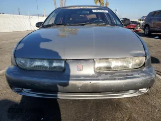 1997 Saturn SW z VIN 1G8ZK8279VZ169005, wystawiony jako Copart lot #73049694 z przebiegiem 110 215 mil mil oraz Szkody całkowita. Historia ofert i sprzedaży dostępna na DreamBid. Obrazek 5.