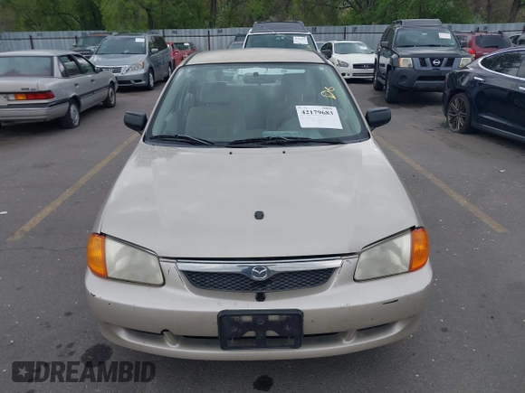 2000 Mazda Protege DX with VIN JM1BJ2227Y0237323, listed as a IAAI auction lot 42179683 with Not Provided miles and . Bid and sale history available at DreamBid. Image 6.