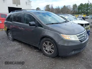 2012 Honda Odyssey EX with VIN 5FNRL5H42CB086159, listed as a IAAI auction lot 42096834 with 208,701 mi miles and . Bid and sale history available at carsss.com. Image 1.