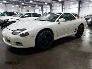 1996 Mitsubishi 3000GT GT z VIN JA3AM84J5TY002387, wystawiony jako Copart lot #64983534 z przebiegiem 149 380 mil mil oraz Szkody całkowita. Historia ofert i sprzedaży dostępna na DreamBid. Obrazek 1.