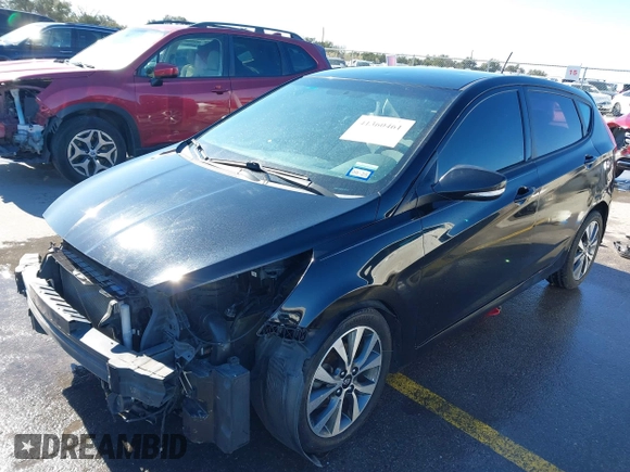 2015 Hyundai Accent Sport with VIN KMHCU5AE8FU233131, listed as a IAAI auction lot 41360461 with 99,480 mi miles. Bid and sale history available at carsss.com. Image 2.