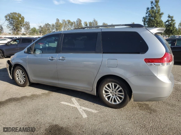 2014 Toyota Sienna XLE with VIN 5TDYK3DC8ES472826, listed as a Copart auction lot 46174385 with 129,094 mi miles and Salvage Title. Bid and sale history available at carsss.com. Image 2.