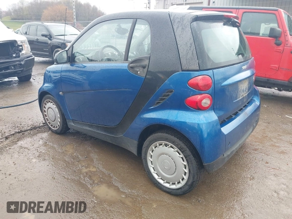 2009 Smart fortwo Pure with VIN WMEEJ31X69K312553, listed as a IAAI auction lot 41957660 with 156,476 mi miles. Bid and sale history available at carsss.com. Image 3.