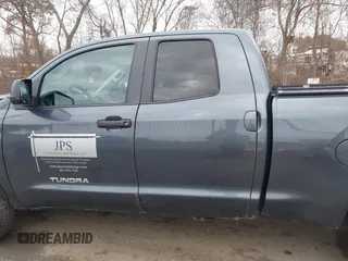 2010 Toyota Tundra with VIN 5TFUM5F16AX005232, listed as a IAAI auction lot 41688311 with 251,296 mi miles and . Bid and sale history available at DreamBid. Image 14.
