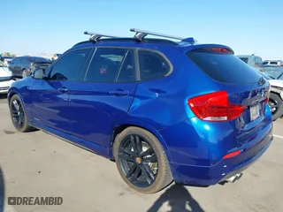 2015 BMW X1 xDrive28i with VIN WBAVL1C56FVY32753, listed as a IAAI auction lot 41759454 with 130,823 mi miles. Bid and sale history available at carsss.com. Image 3.