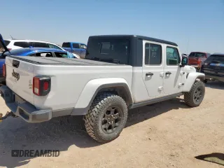 2023 Jeep Gladiator Sport S with VIN 1C6HJTAG4PL564716, listed as a Copart auction lot 57489125 with 20,971 mi miles and Salvage title. Bid and sale history available at DreamBid. Image 3.