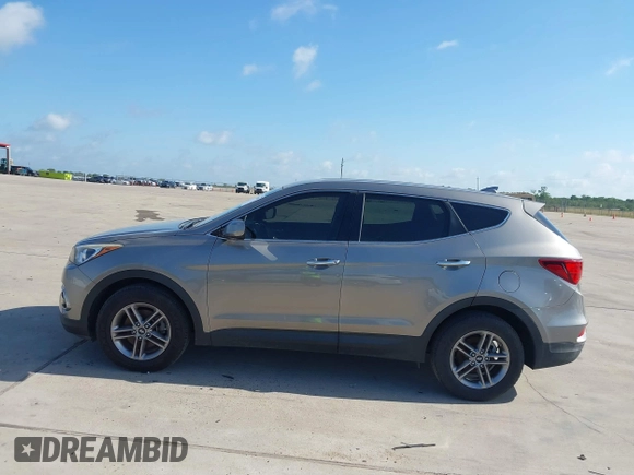 2017 Hyundai Santa Fe 2.4L z VIN 5XYZTDLB7HG444033, wystawiony jako IAAI lot #42263907 z przebiegiem 107 454 mil mil oraz . Historia ofert i sprzedaży dostępna na DreamBid. Obrazek 14.