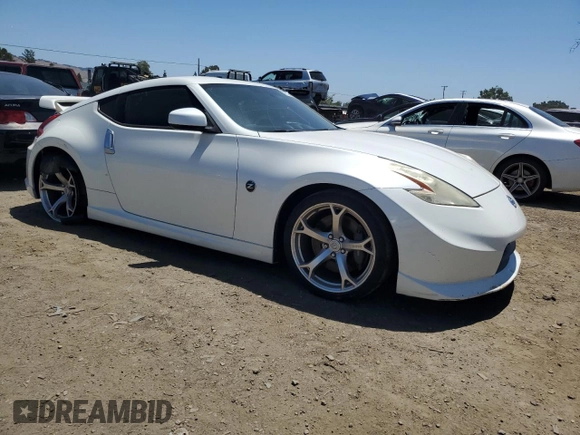 2011 Nissan 370Z Touring z VIN JN1AZ4EH7BM551606, wystawiony jako Copart lot #57173945 z przebiegiem Nie podano mil oraz Szkoda całkowita • Salvage title. Historia ofert i sprzedaży dostępna na DreamBid. Obrazek 4.