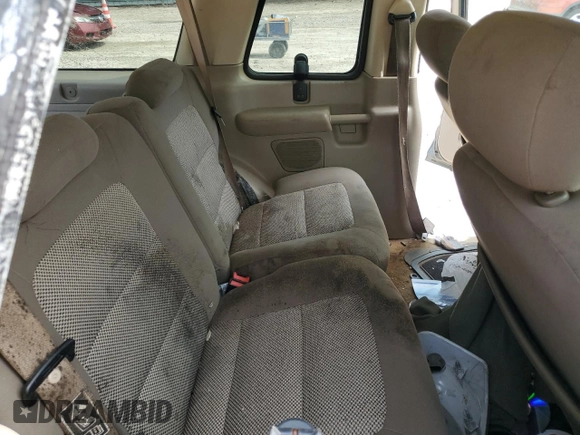 2003 Ford Explorer Sport XLS z VIN 1FMYU60E03UC12105, wystawiony jako Copart lot #67044604 z przebiegiem 277 642 mil mil oraz Szkody całkowita. Historia ofert i sprzedaży dostępna na DreamBid. Obrazek 10.