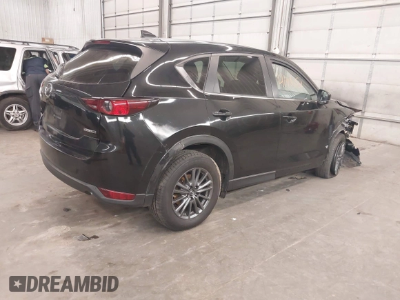 2020 Mazda CX-5 Touring with VIN JM3KFBCM9L1785125, listed as a IAAI auction lot 41983561 with 101,062 mi miles and . Bid and sale history available at carsss.com. Image 4.