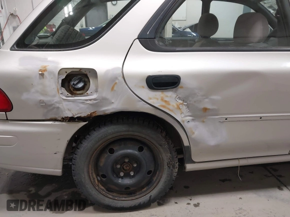 1999 Subaru Impreza L with VIN JF1GF4357XH811307, listed as a IAAI auction lot 41505426 with 195,693 mi miles and . Bid and sale history available at DreamBid. Image 6.