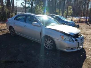 2010 Toyota Avalon XL with VIN 4T1BK3DB2AU367617, listed as a IAAI auction lot 41346504 with 215,525 mi miles and . Bid and sale history available at carsss.com. Image 1.
