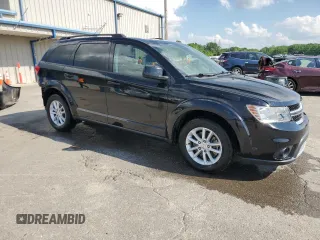 2014 Dodge Journey SXT with VIN 3C4PDCBG5ET126590, listed as a Copart auction lot 54770335 with 126,950 mi miles and Salvage Title. Bid and sale history available at DreamBid. Image 4.