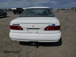 1993 Ford Taurus z VIN 1FALP5348PG189055, wystawiony jako Copart lot #58589175 z przebiegiem 45 421 mil mil oraz Tytuł czysty. Historia ofert i sprzedaży dostępna na DreamBid. Obrazek 6.
