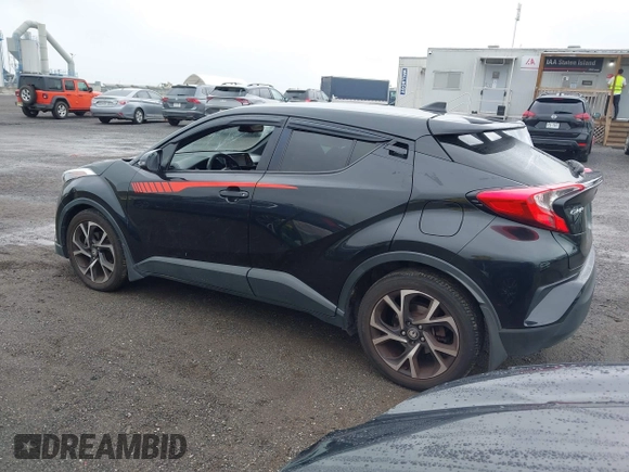 2018 Toyota C-HR XLE with VIN JTNKHMBX6J1000904, listed as a IAAI auction lot 42513117 with 77,192 mi miles and . Bid and sale history available at DreamBid. Image 3.