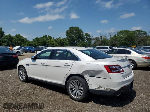 2014 Ford Taurus Limited with VIN 1FAHP2F84EG121559, listed as a Copart auction lot 61764825 with 82,548 mi miles and Salvage title. Bid and sale history available at DreamBid. Image 2.