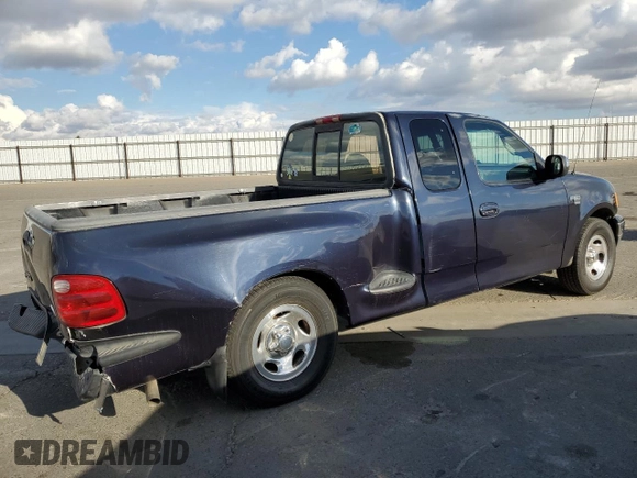2000 Ford F-150 with VIN 1FTRX07W3YKA56561, listed as a Copart auction lot 81149654 with 185,967 mi miles and Salvage title. Bid and sale history available at DreamBid. Image 3.