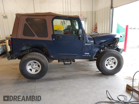 2003 Jeep Wrangler Sport with VIN 1J4FA49S53P311822, listed as a IAAI auction lot 41621710 with 156,023 mi miles. Bid and sale history available at carsss.com. Image 13.