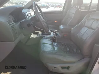 2002 Jeep Grand Cherokee Limited with VIN 1J4GX58N12C282300, listed as a Copart auction lot 74939754 with 166,018 mi miles and Salvage Title. Bid and sale history available at DreamBid. Image 7.