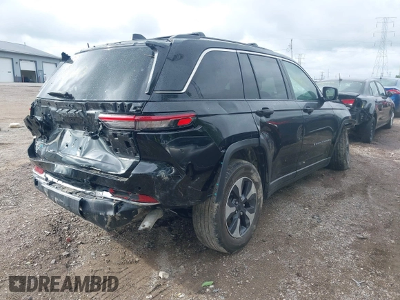 2022 Jeep Grand Cherokee with VIN 1C4RJYB69N8715243, listed as a IAAI auction lot 42319323 with 23,405 mi miles and . Bid and sale history available at DreamBid. Image 4.
