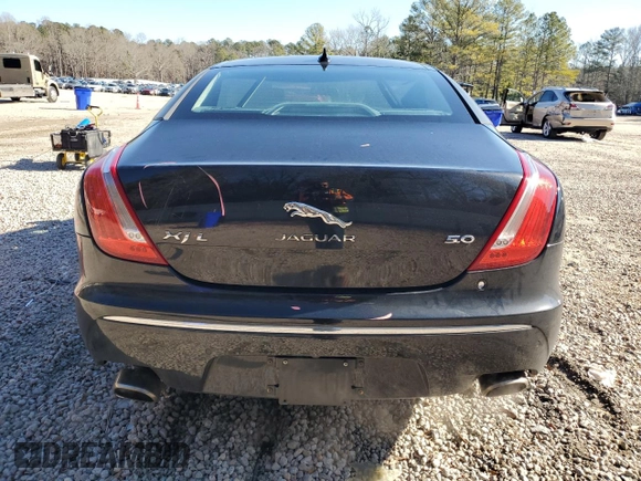 2015 Jaguar XJ with VIN SAJWA2GT8FMV83276, listed as a Copart auction lot 86521754 with 105,010 mi miles and Salvage Title. Bid and sale history available at DreamBid. Image 6.