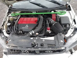 2014 Mitsubishi Lancer Evolution GSR with VIN JA32W8FV5EU012572, listed as a IAAI auction lot 40871463 with 89,529 mi miles. Bid and sale history available at carsss.com. Image 10.