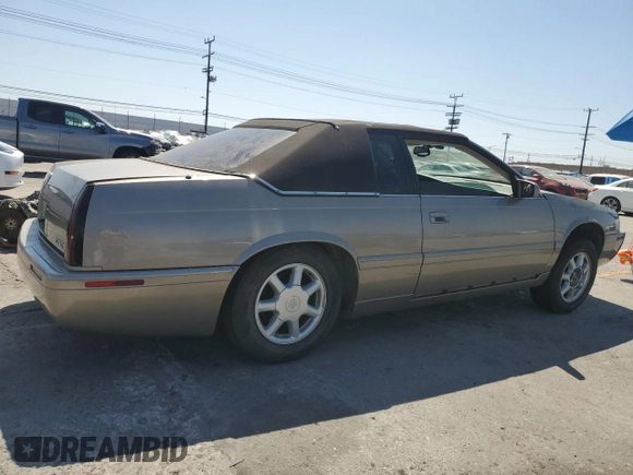 2002 Cadillac Eldorado Touring ETC z VIN 1G6ET12952B101866, wystawiony jako Copart lot #57365965 z przebiegiem Nie podano mil oraz Tytuł czysty. Historia ofert i sprzedaży dostępna na DreamBid. Obrazek 3.