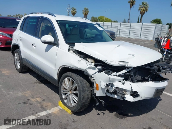 2014 Volkswagen Tiguan SEL with VIN WVGAV3AX9EW512956, listed as a IAAI auction lot 42110002 with 136,034 mi miles and . Bid and sale history available at DreamBid. Image 1.