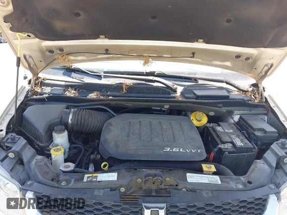 2015 Dodge Grand Caravan American Value with VIN 2C4RDGBG3FR647957, listed as a IAAI auction lot 42147813 with 129,859 mi miles and . Bid and sale history available at DreamBid. Image 10.