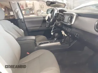 2016 Toyota Tacoma SR5 with VIN 3TMDZ5BN2GM007990, listed as a IAAI auction lot 41288736 with 76,179 mi miles. Bid and sale history available at carsss.com. Image 5.