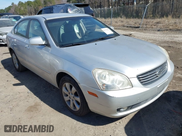 2007 Kia Optima EX with VIN KNAGE124975157963, listed as a IAAI auction lot 41673886 with 128,278 mi miles. Bid and sale history available at carsss.com. Image 1.
