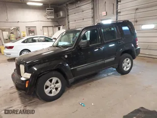 2009 Jeep Liberty Sport with VIN 1J8GN28K79W547903, listed as a IAAI auction lot 41889962 with 127,821 mi miles. Bid and sale history available at carsss.com. Image 2.