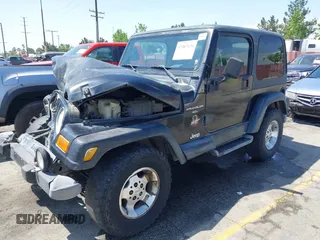 2001 Jeep Wrangler Sahara with VIN 1J4FA59SX1P337951, listed as a IAAI auction lot 42087134 with 154,479 mi miles and . Bid and sale history available at carsss.com. Image 2.