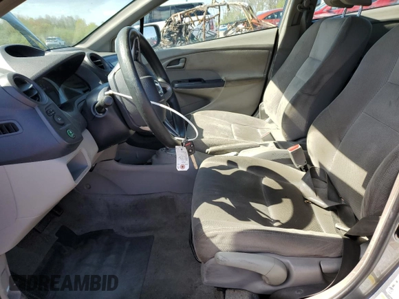 2010 Honda Insight LX z VIN JHMZE2H59AS000085, wystawiony jako Copart lot #54932975 z przebiegiem 218 961 mil mil oraz Szkoda całkowita • Salvage title. Historia ofert i sprzedaży dostępna na DreamBid. Obrazek 7.
