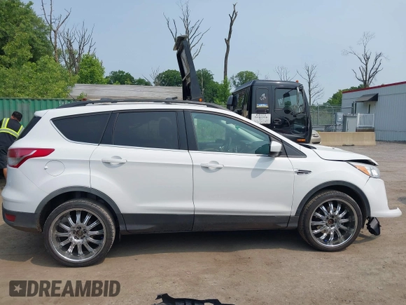 2014 Ford Escape SE with VIN 1FMCU9G99EUC81141, listed as a IAAI auction lot 42436279 with 123,947 mi miles and . Bid and sale history available at DreamBid. Image 13.