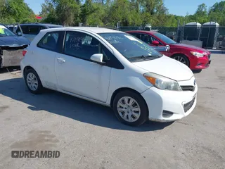 2014 Toyota Yaris L with VIN VNKJTUD35EA011933, listed as a IAAI auction lot 42150303 with 114,369 mi miles. Bid and sale history available at carsss.com. Image 1.
