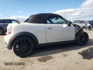 2012 MINI Roadster S z VIN WMWSY3C57CT144767, wystawiony jako Copart lot #76274884 z przebiegiem 44 896 mil mil oraz Tytuł czysty. Historia ofert i sprzedaży dostępna na DreamBid. Obrazek 3.